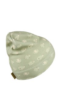Green baby hat with a pattern of small, light-colored sheep scattered across the fabric.