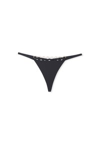 Un string noir en tissu lisse avec une taille basse, orné d'accents circulaires dorés le long de la ceinture.