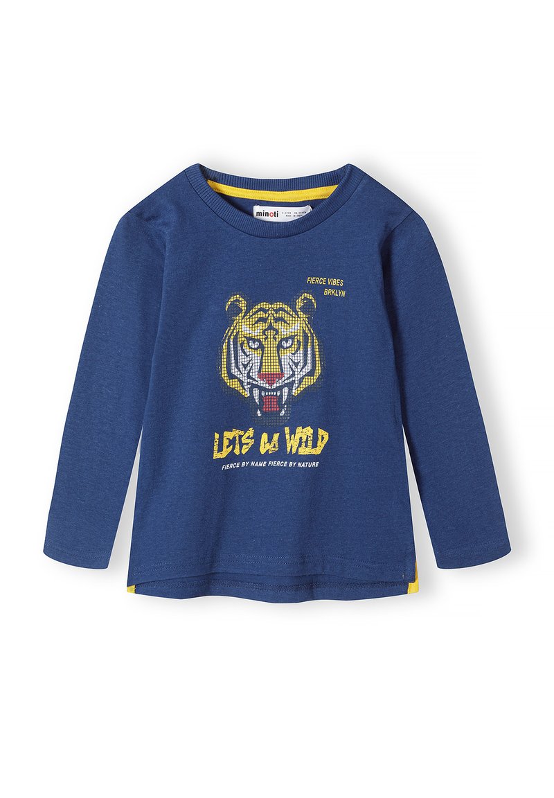 Kék, hosszú ujjú póló, amely pamutból készült, sárga és fehér akcentusokkal ellátott tigris grafikával. A szöveg olvasható: "HÁRAM IKONFELENÉK!"). Sárga díszítás az alján.