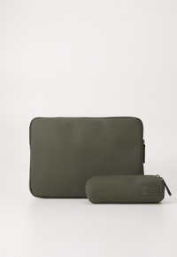 Olive green laptop sleeve and matching cylindrical case, made of smooth material, featuring a zipper and embossed "Reuse Recycle Repeat" text.