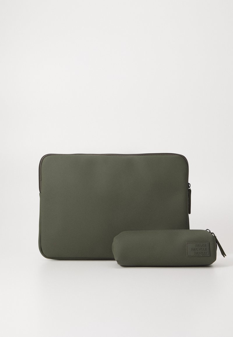 Olive green laptop sleeve and matching cylindrical case, made of smooth material, featuring a zipper and embossed "Reuse Recycle Repeat" text.