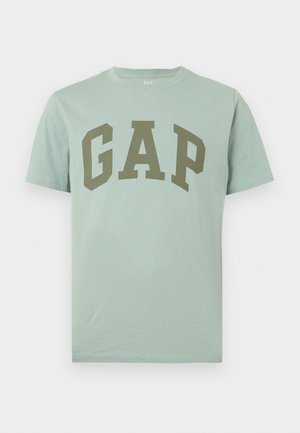 Lys grønn kortermet bomulls-T-skjorte med stor olivengrønn GAP-logo trykt over brystet.