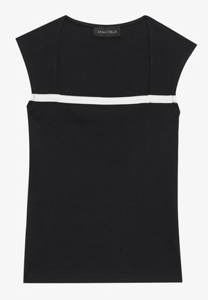 Débardeur noir ajusté avec texture côtelée et manches courtes, présentant une bande blanche horizontale à la poitrine et une étiquette au niveau du col.