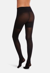 Collant neri opachi con una superficie liscia, vita alta e design con piede, che offrono una copertura completa delle gambe e un aspetto senza soluzione di continuità.
