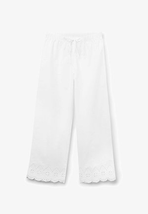 Bílé volné kalhoty s elastickým pasem a stahovací šňůrkou, s krajkovým lemováním s květinovými výřezy na spodním okraji.