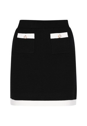 Fekete texturált miniszoknya fehér szegéllyel az alján és a zsebek tetején, mely két elülső zsebbel rendelkezik, mindegyiken gyöngygombos díszítéssel.