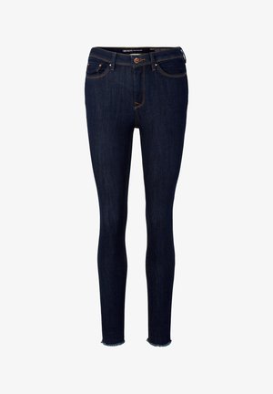 Tumši džinsi ar šauru piegriezumu un augstu jostasvietu, ar saplēstu maliņu un oranžiem diegiem. Iekļauj priekšējo rāvējslēdzēju, pogu aizdari un piecas kabatas.