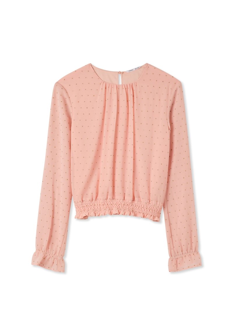 Maglietta rosa a maniche lunghe con scollatura arricciata e orlo smock. Presenta piccoli pois dorati e polsini elasticizzati per aggiungere un tocco di dettaglio.