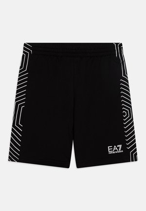 Črne športne hlače s elastičnim pasom. Imajo bel geometrijski vzorec na straneh in majhen logotip na spodnjem sprednjem delu.