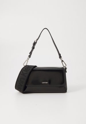 Calvin Klein MUST STRAP MINI BAG SHINY - Borsa a mano - black