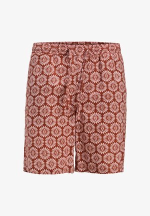 Brune mønstrede badetights med elastisk talje. Har et blomstermønster i lyserødt, lavet af let, åndbart stof.