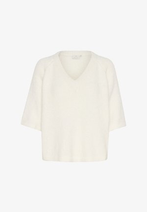 Vit, överdimensionerad kortärmad tröja med V-ringning, tillverkad av mjukt, texturerat tyg. Har raglanärmar och en rak fåll.