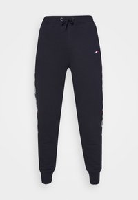 Navy Sweatpants mit Kordelzugbund, gerippten Bündchen und einem seitlichen Logomuster in kontrastierenden Farben. Aus Baumwoll-Mischgewebe.