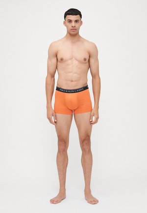 Orange boxer Shorts aus weichem Stoff mit einem schwarzen Bund, der das Markenlogo "POLO RALPH LAUREN" trägt. Enganliegendes Design und mittellange Beine.