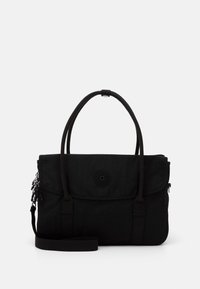Black canvas handbag with dual handles, adjustable shoulder strap, flap closure, and logo accent. Smooth texture and sleek design.