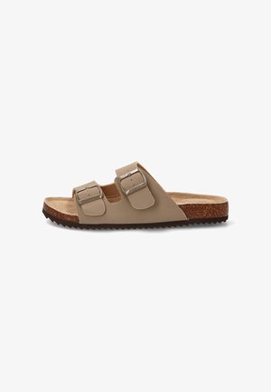 Sandalia beige de punta abierta con dos hebillas ajustables, plantilla de corcho y suela negra texturizada.