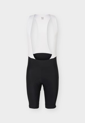 Pantaloni scurți de ciclism negri cu bretele albe pe umeri, zonă șezut căptușită și etichetă de mărime medie vizibilă pe interiorul spate.