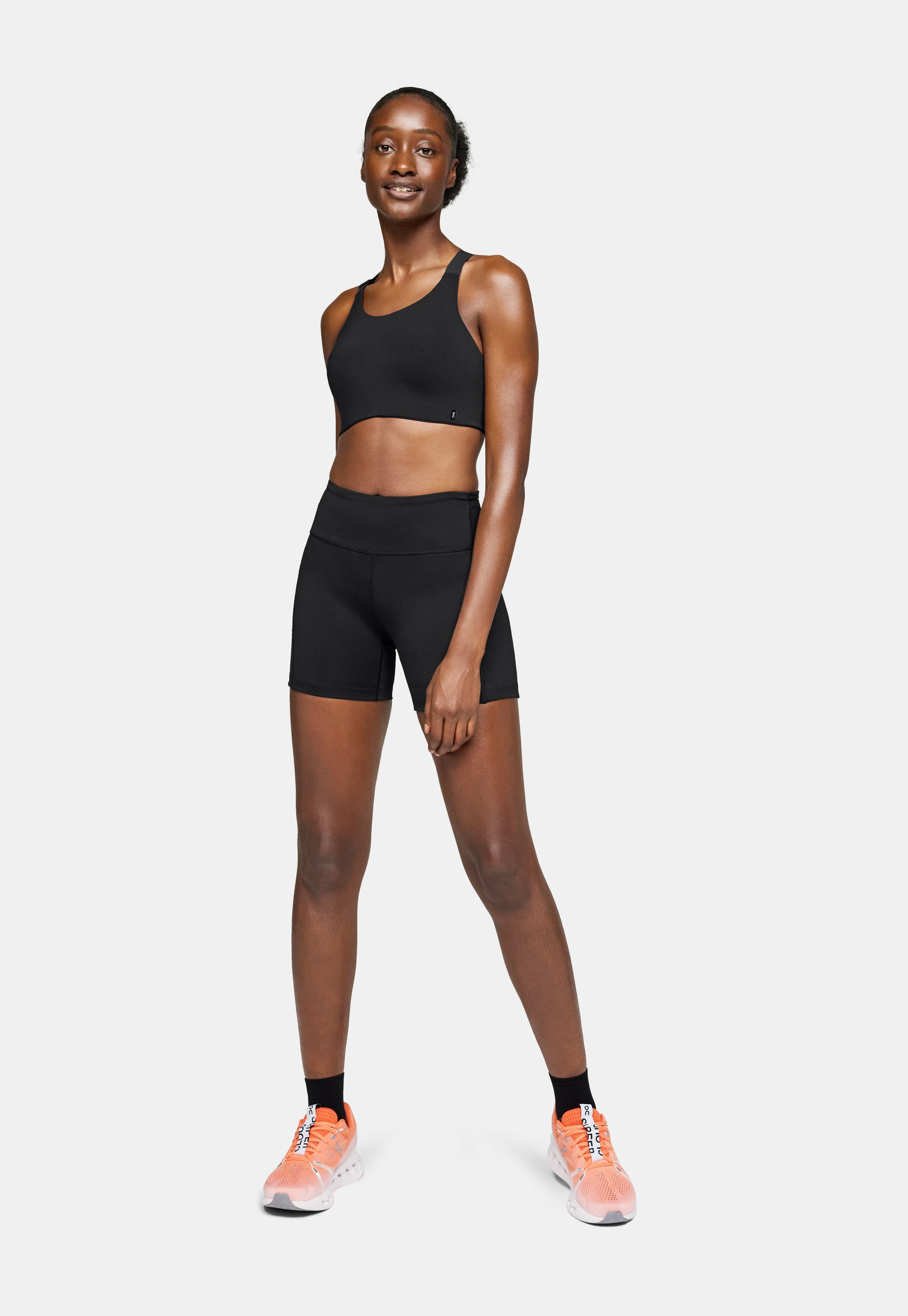 Wearing Shorts Shorts With Black Leggings On PERFORMANCE Leggings