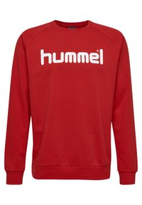 Sudadera roja con cuello redondo y mangas raglán largas. En la parte frontal se muestra la palabra "hummel" en grandes letras blancas.