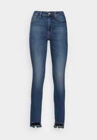 Jeans ajustados de denim azul oscuro, con cintura alta, textura desgastada y dobladillos deshilachados para un estilo casual.