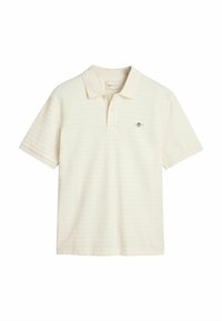 Polo à manches courtes en crème clair avec une texture rayée subtile, doté d'un col classique et d'un petit logo sur la poitrine.