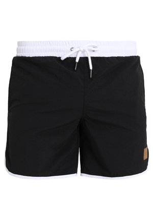 Pantaloni da bagno neri con una cintura stretta bianca, caratterizzati da un piccolo etichetta marrone sul lato e un bordo bianco lungo l'orlo.