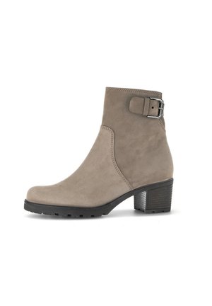 Taupe suede ankle boot with a tapered heel, side buckle accent, and textured sole, featuring a smooth finish and streamlined design.