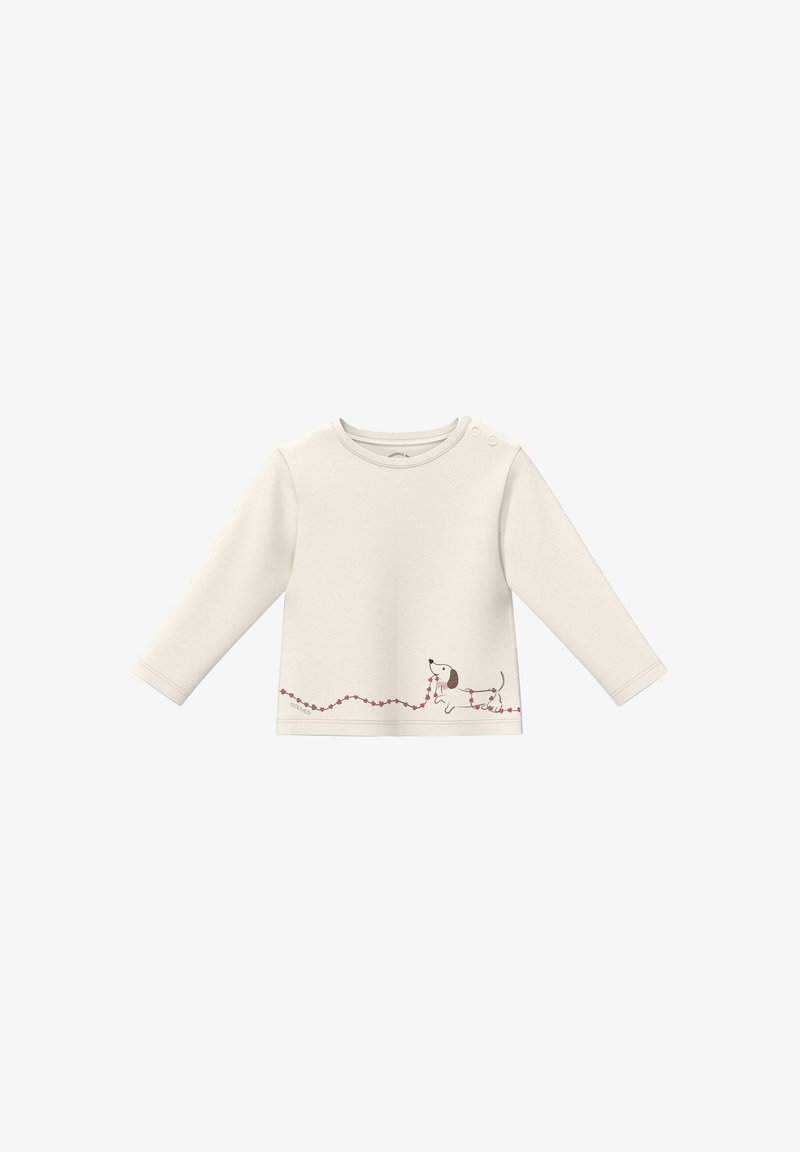 Chemise longue crème pour bébé avec boutons-pression sur l'épaule et un chien joueur tenant une ficelle rouge en forme de cœur en bas à l'avant.