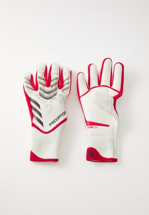 Weiße Torwarthandschuhe mit roten Akzenten. Strukturierten grauen Griff an den Fingerspitzen, verstärkter Daumen und elastisches Handgelenk für einen sicheren Sitz.