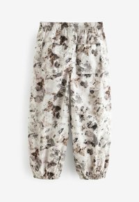 Leichte, cremefarbene Hosen mit abstrakten braunen und grauen Mustern, elastischem Bund und elastischen Bündchen, ausgestattet mit zwei Gesäßtaschen.