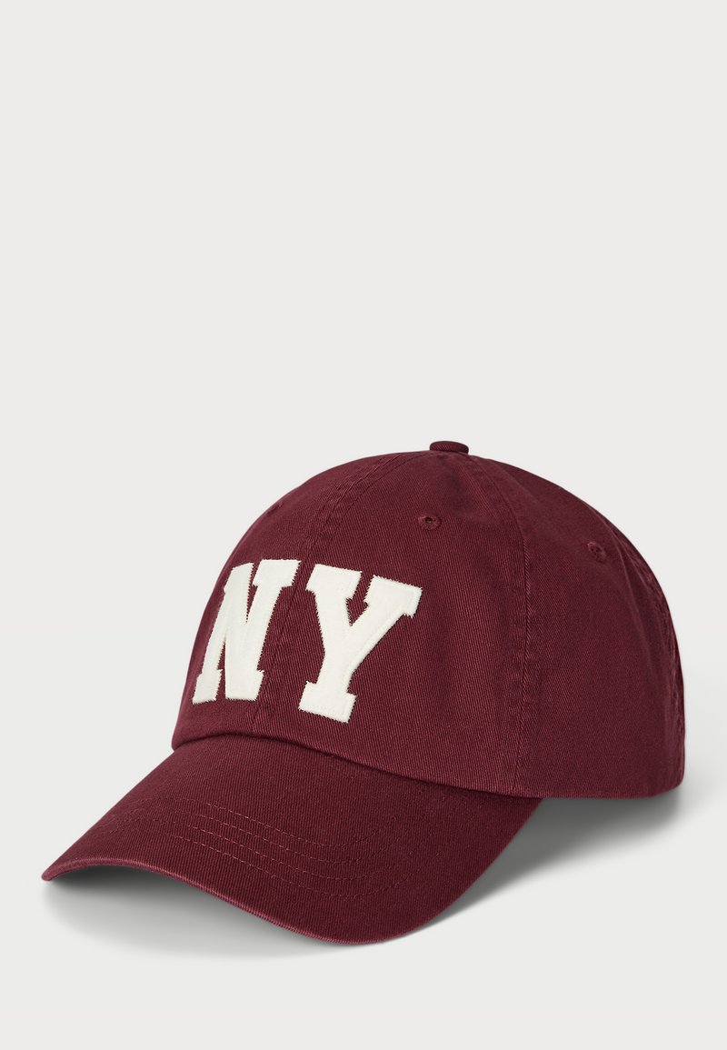 Maroon baseball cap with white "NY" embroidered letters on the front, curved visor, and cotton fabric. Features metal eyelets for ventilation.