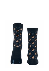 Chaussettes en coton noir ornées d'un motif de petits rennes orange sur un quadrillage en forme de losange bleu marine, avec des bords côtelés et des accents bleus.