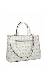 Witte designertas met beige monogrammotief, dubbele handvatten, afneembare schouderriem en ritssluiting voorvak.