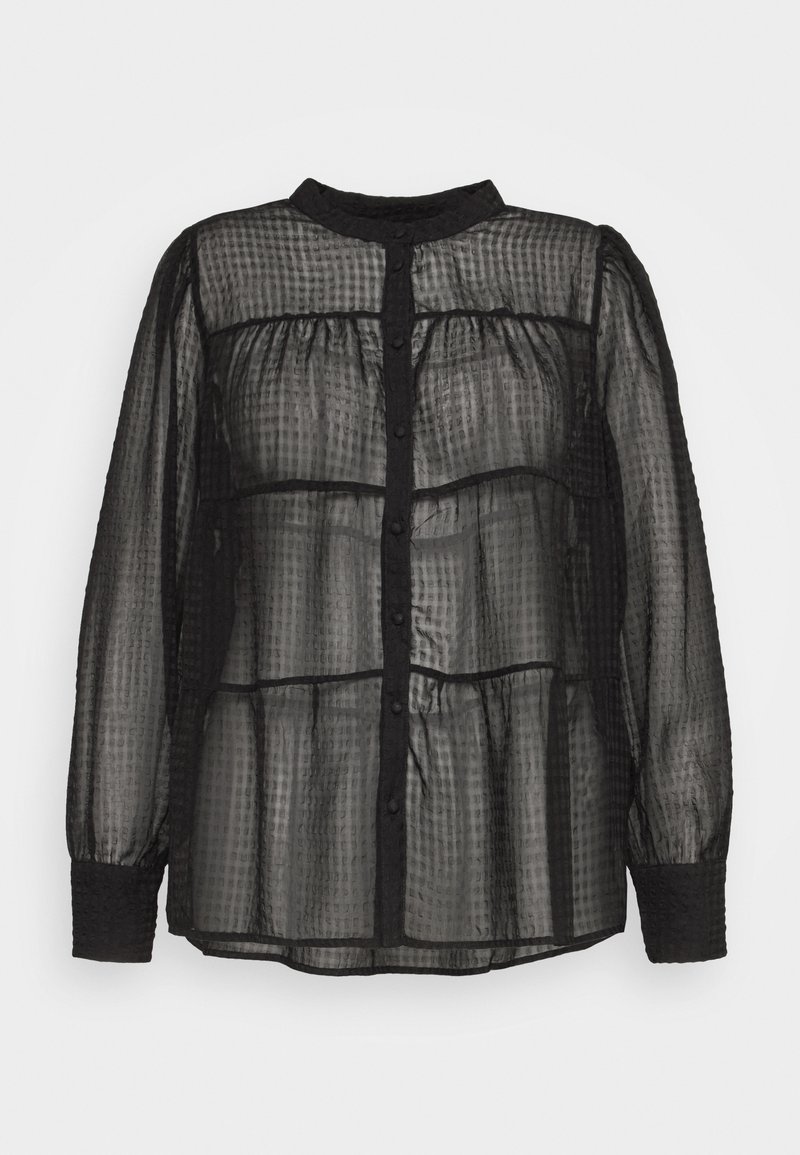 Blouse noire transparente à motif à carreaux texturé, manches longues bouffantes, col montant, devant boutonné et larges poignets ajustés.