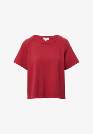 T-shirt rouge à manches courtes en tissu texturé, avec un col large et arrondi et des manches raglan ; comporte une étiquette à l'intérieur.