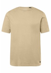 Béžové tričko s krátkým rukávem a kulatým výstřihem. Vyrobeno z měkké látky s hladkým povrchem. Obsahuje malou černou logovou aplikaci na lemu.
