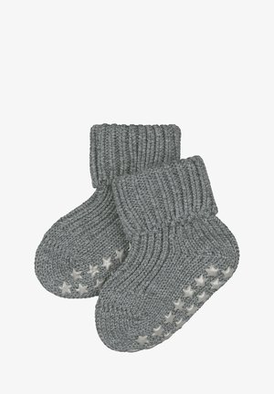 Grijze gebreide baby sokken met een geribde boord en sterpatroon antislipzolen. Zachte textuur en ronde vorm voor comfort en veiligheid.