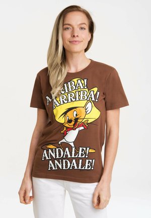 Brown cotton t-shirt featuring a cartoon character with a yellow sombrero, text in white and black, short sleeves, and a relaxed fit.