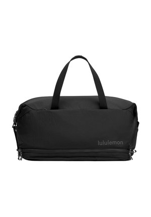 Borsone nero con una texture liscia, doppi manici superiori, scomparti con zip e un logo sottile sul lato. Design rettangolare.