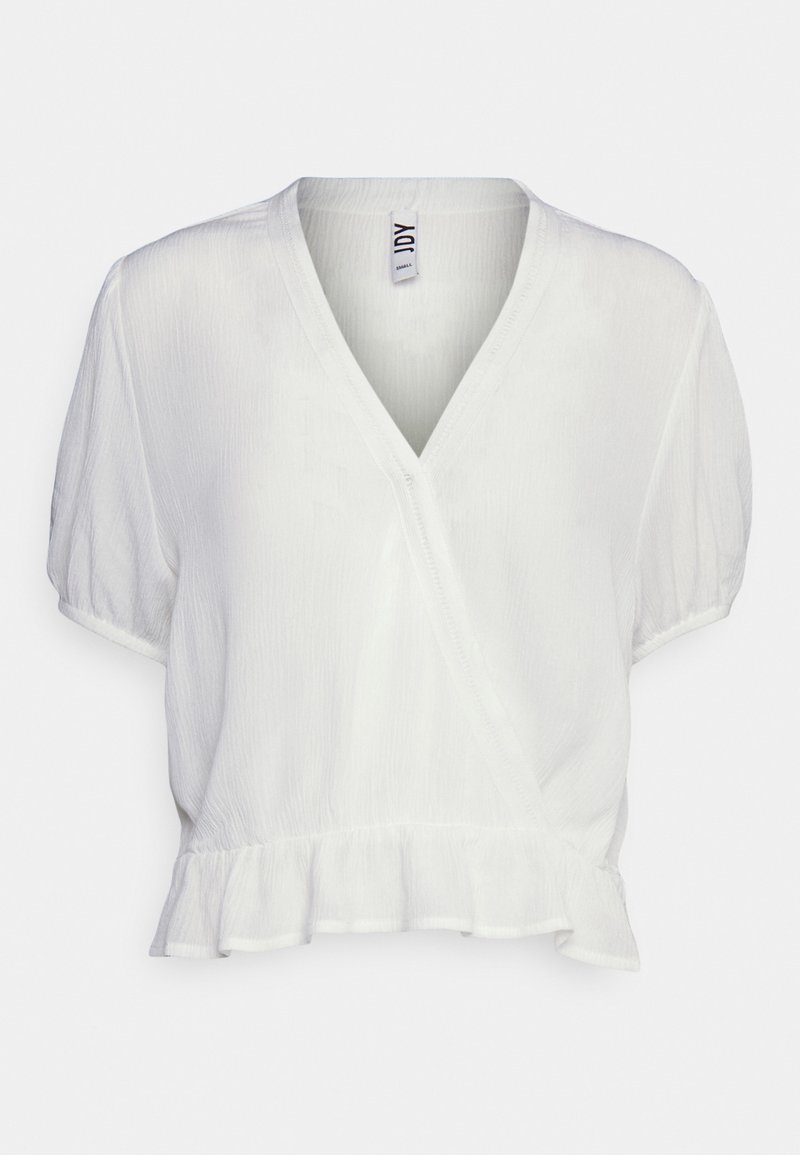 Blouse blanche à manches courtes, col en V avec devant cache-cœur, tissu léger texturé, taille élastique et détail volants au bas.
