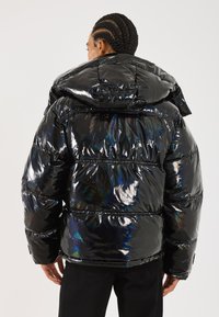 Black puffer jacket with a shiny, iridescent finish. Features a hood and horizontal quilted design with elastic cuffs and hem.