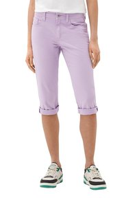 Lilac cropped pants with rolled cuffs, five pockets, and a button closure. Worn with white and black sneakers featuring teal accents.