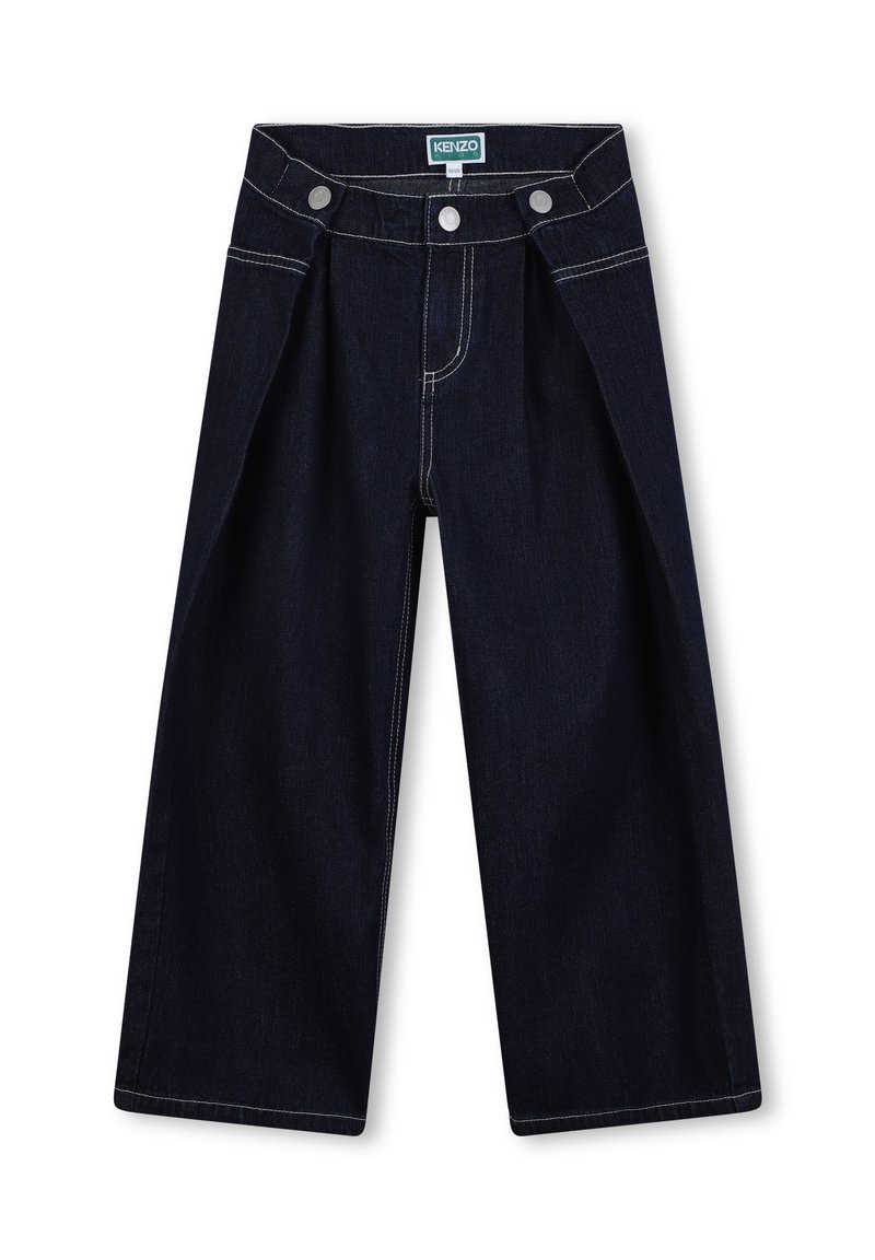 Pantalon en denim foncé à jambes larges, avec une taille haute, deux boutons sur le devant, et des coutures blanches contrastantes le long des coutures.