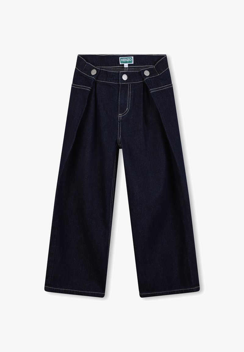 Pantalon en denim foncé à jambes larges, avec une taille haute, deux boutons sur le devant, et des coutures blanches contrastantes le long des coutures.