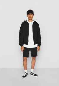 Urban Classics Tracksuit bottoms - black