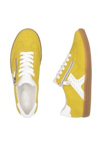 Yellow suede sneakers with white leather accents, featuring a zip and traditional laces, rubber sole, and perforated side detail.