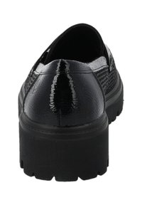 Scarpe slip-on nere con superficie texturizzata, suola piatta robusta e tacco arrotondato. Finitura lucida con dettagli sottili sul retro.