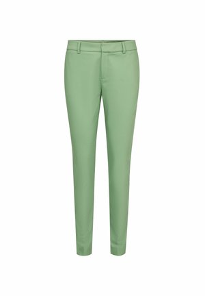 Strakke lichtgroene broek met riemlussen en een ritssluiting aan de voorkant, weergegeven tegen een effen witte achtergrond.