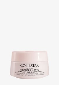 Crema notte Collistar Rigenera in un barattolo rotondo di vetro satinato con coperchio rosa e testo nero che dettaglia le caratteristiche principali e l'uso.