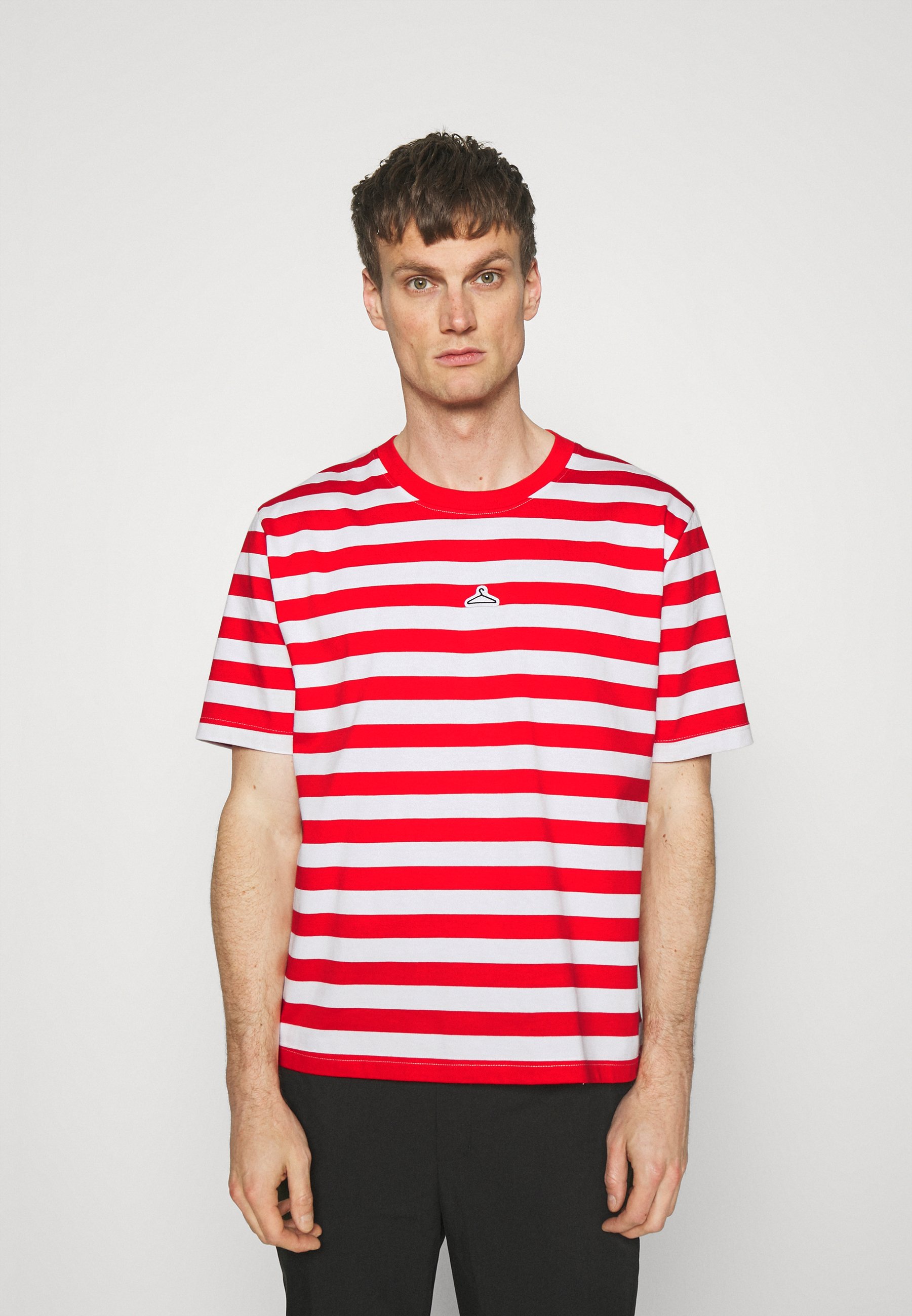 black paint and blue shirt